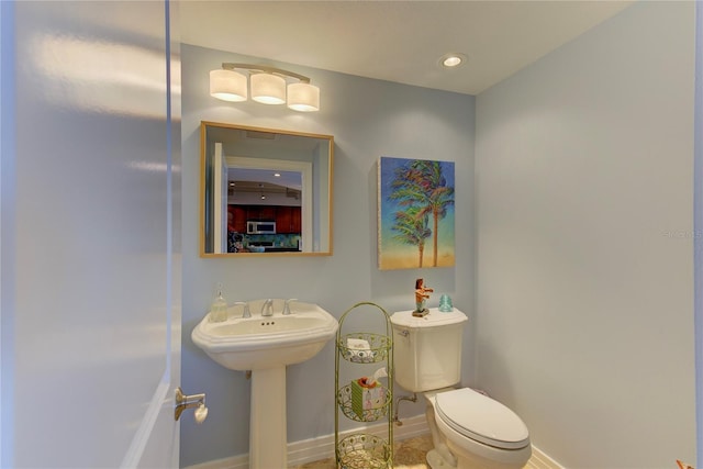 bathroom featuring sink and toilet