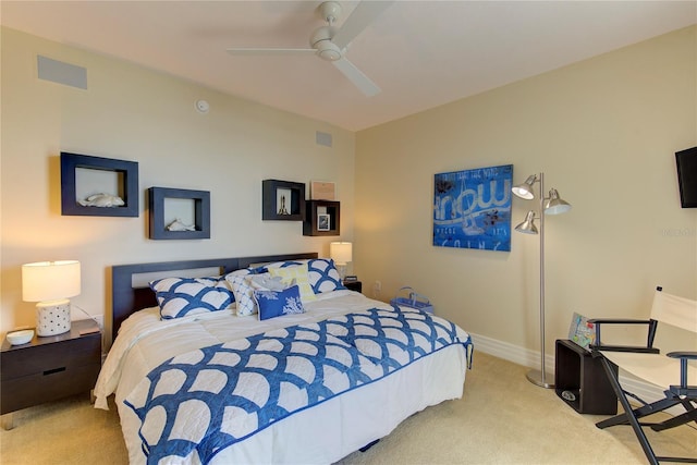 bedroom with ceiling fan and light colored carpet