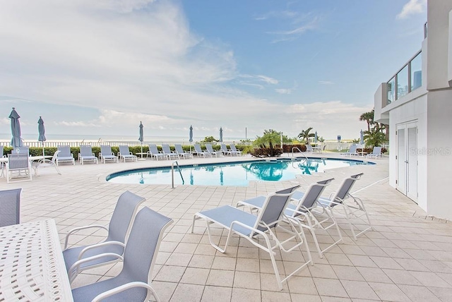 view of swimming pool with a patio area