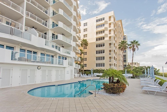 view of swimming pool featuring a patio area