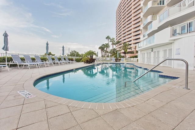 view of pool featuring a patio area