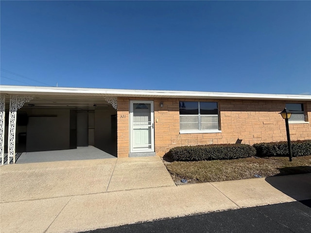 view of front of home with a carport