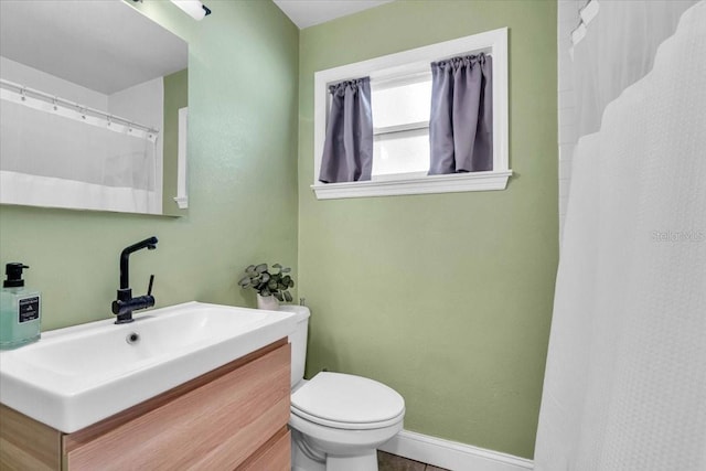 bathroom with vanity and toilet