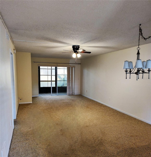 unfurnished room with a textured ceiling, carpet floors, and ceiling fan