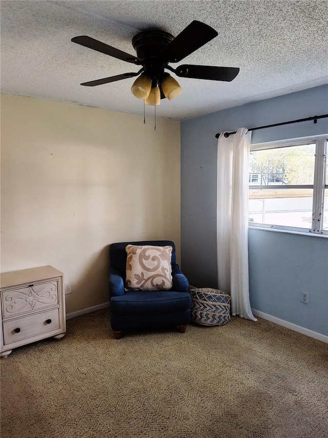 unfurnished room with ceiling fan, carpet floors, and a textured ceiling