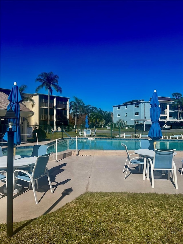 view of pool featuring a patio