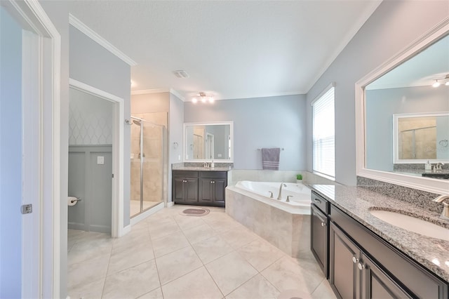 bathroom featuring crown molding, tile patterned floors, vanity, and independent shower and bath