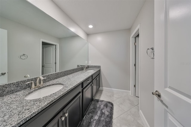 bathroom with vanity and tile patterned flooring