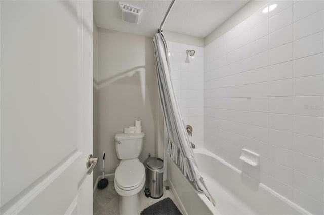 bathroom with a textured ceiling, shower / bathtub combination with curtain, tile patterned floors, and toilet