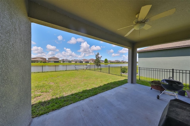 view of yard with a patio area and ceiling fan