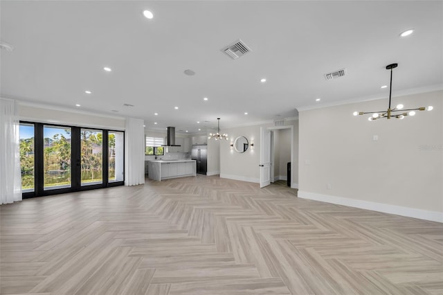 unfurnished living room with crown molding, light parquet flooring, french doors, and a chandelier