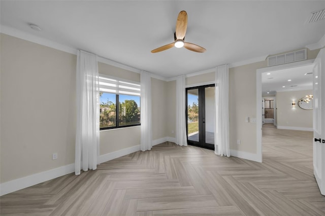 spare room with french doors, ceiling fan, light parquet flooring, and ornamental molding