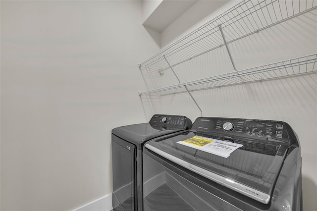 clothes washing area with independent washer and dryer