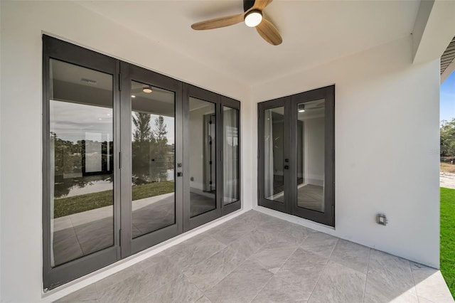 view of patio / terrace with french doors and ceiling fan