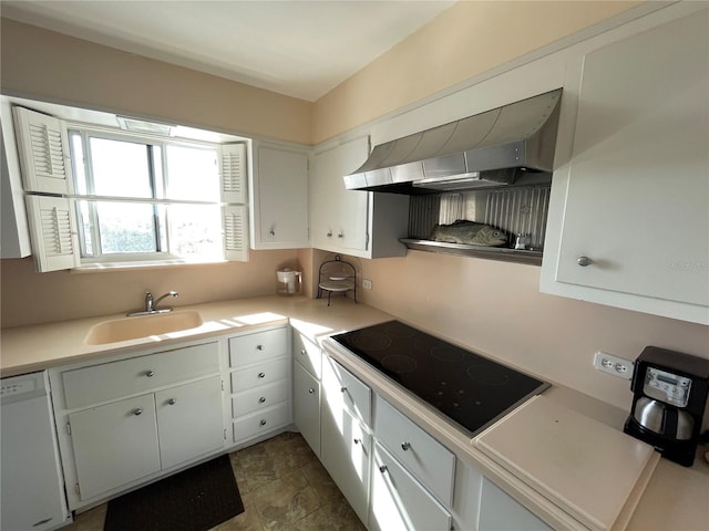 kitchen with sink, white cabinetry, black electric cooktop, white dishwasher, and wall chimney range hood