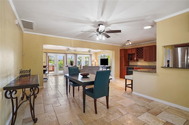 dining room with french doors and crown molding