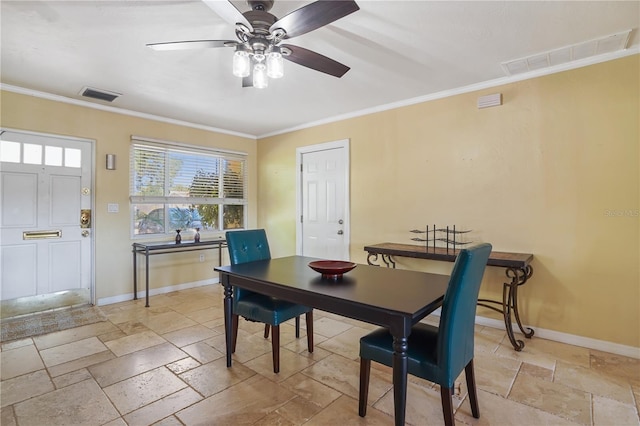 dining area with crown molding and ceiling fan