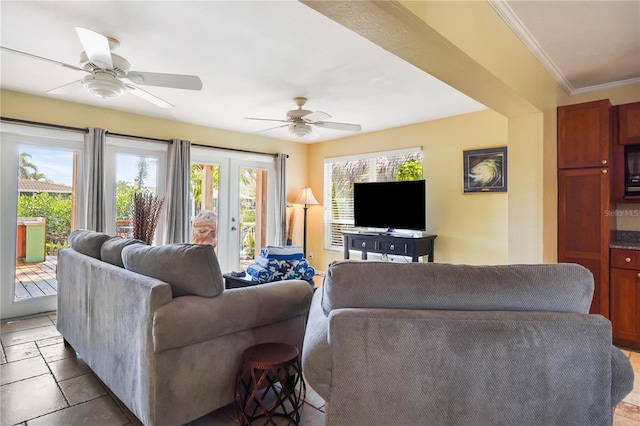 living room with crown molding and ceiling fan