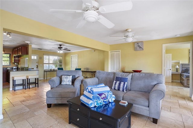 living room with ceiling fan