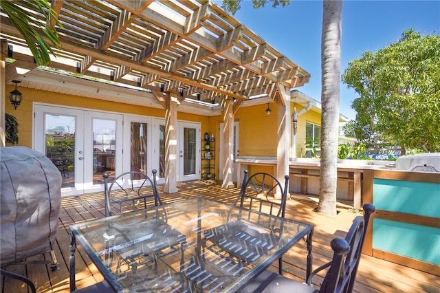 wooden terrace with french doors and a pergola