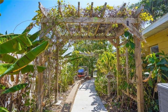 exterior space featuring central AC and a pergola