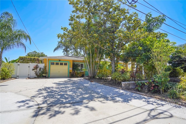 obstructed view of property featuring a garage