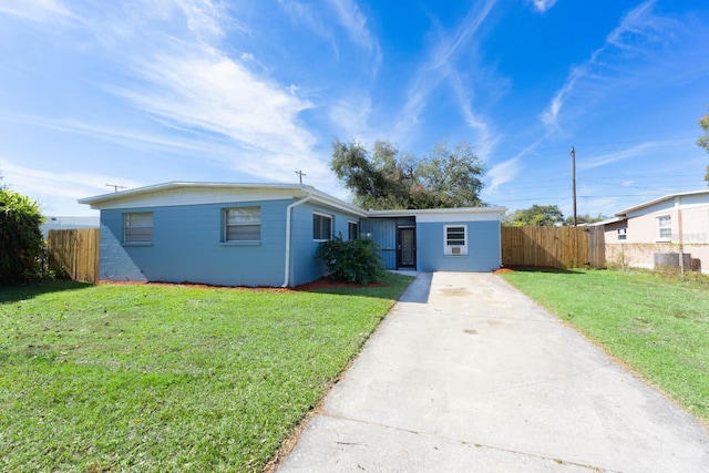 single story home featuring a front yard