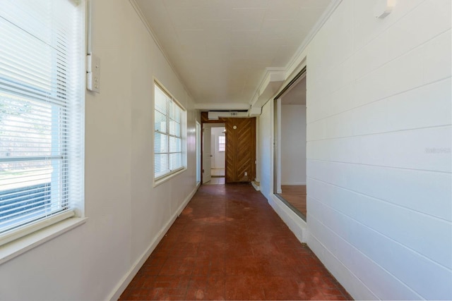 hallway featuring ornamental molding