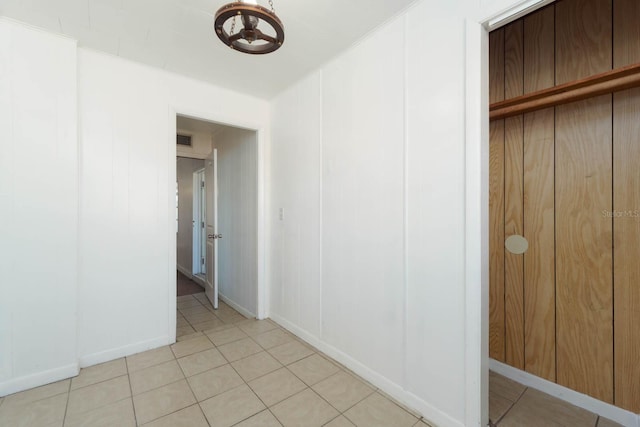 unfurnished bedroom featuring light tile patterned flooring