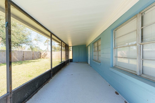 unfurnished sunroom featuring a wealth of natural light