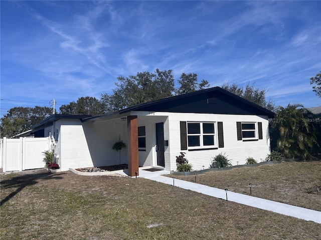 ranch-style house with a front yard