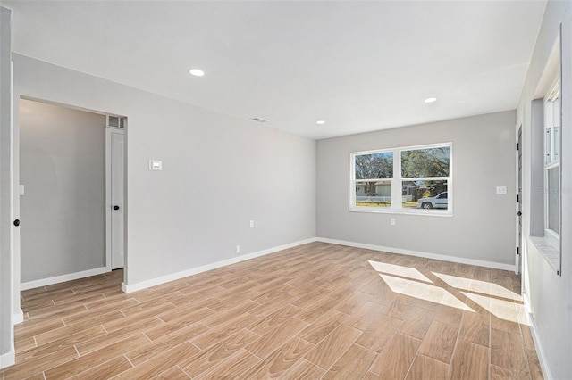 spare room with light wood-type flooring