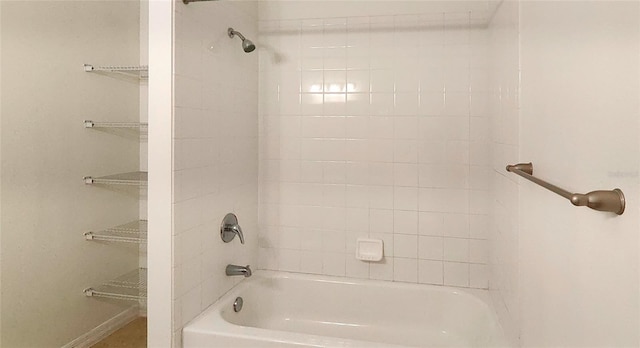 full bath featuring shower / bathtub combination and baseboards