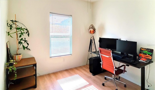 office space featuring wood finished floors and baseboards