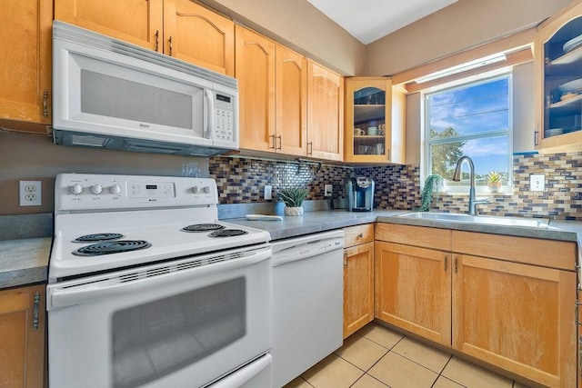 kitchen with sink, white appliances, tasteful backsplash, light tile patterned flooring, and light brown cabinets