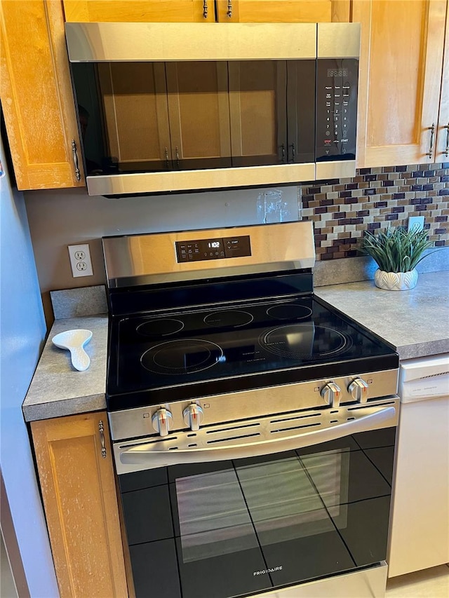 kitchen with dishwasher, stainless steel electric range oven, light countertops, and backsplash
