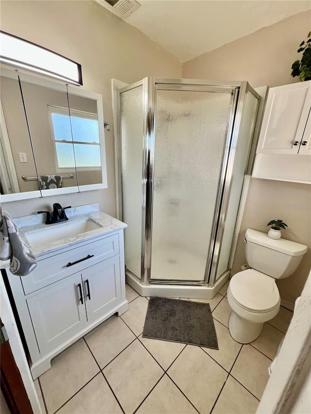 full bath with visible vents, toilet, vanity, tile patterned flooring, and a stall shower