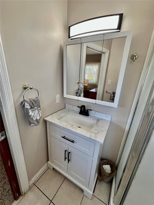 bathroom featuring tile patterned flooring and vanity