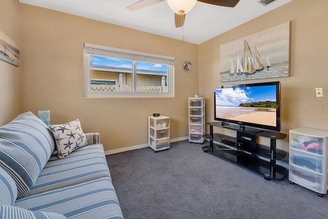 living area with ceiling fan, baseboards, visible vents, and carpet floors