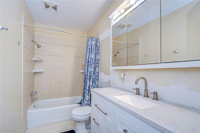 full bathroom with shower / tub combo, vanity, tile patterned floors, and toilet