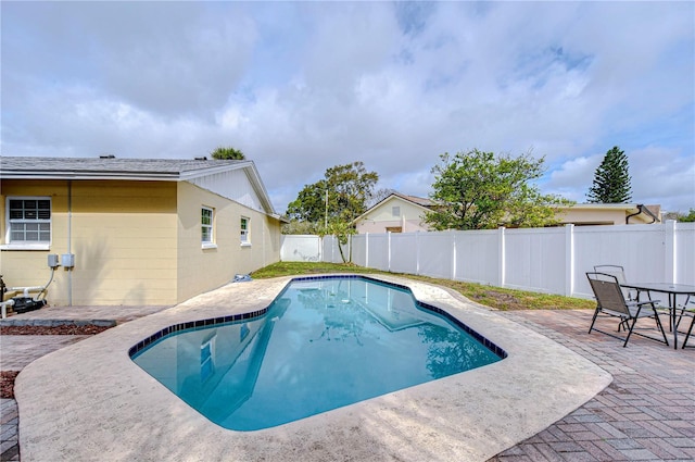 view of swimming pool with a patio