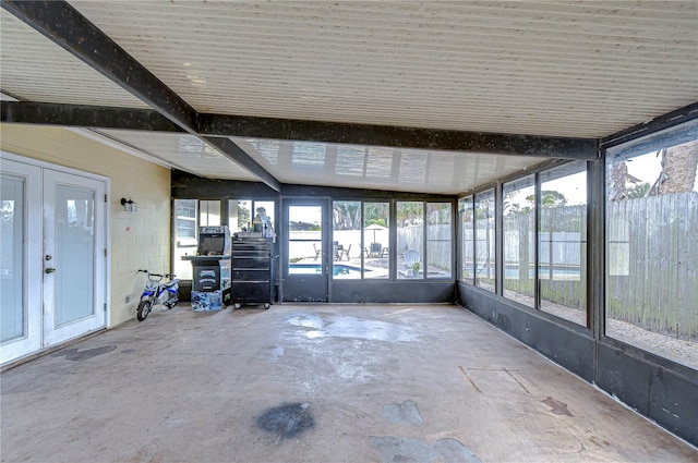 unfurnished sunroom featuring french doors