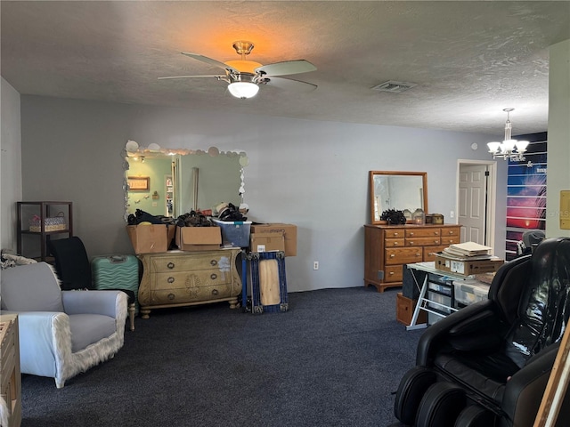 living area featuring a textured ceiling, visible vents, carpet flooring, and ceiling fan with notable chandelier