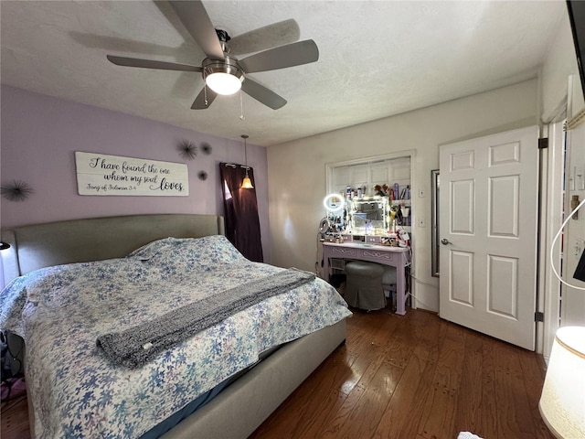 bedroom with wood-type flooring and a ceiling fan