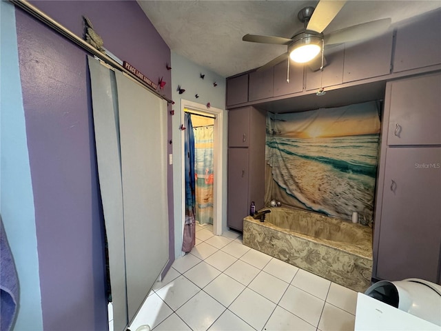 full bathroom with tile patterned floors, a ceiling fan, and a bathing tub