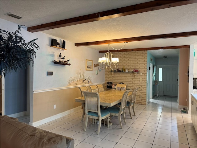 dining room featuring visible vents, light tile patterned floors, beam ceiling, a textured ceiling, and a notable chandelier