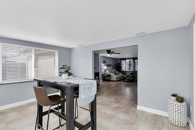 dining space with ceiling fan