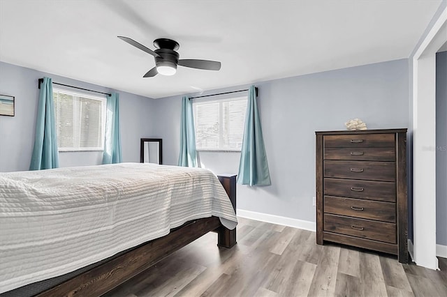 bedroom featuring light hardwood / wood-style flooring and ceiling fan