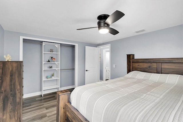 bedroom featuring ceiling fan, wood-type flooring, and a closet