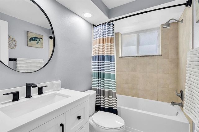 full bathroom with vanity, toilet, and shower / bath combo with shower curtain